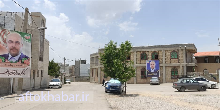 سوءاستفاده ستاد قالیباف از یک افتتاحیه/ نصب بنر جلوی مسجد تل زالی یاسوج و اعتراض مردمی